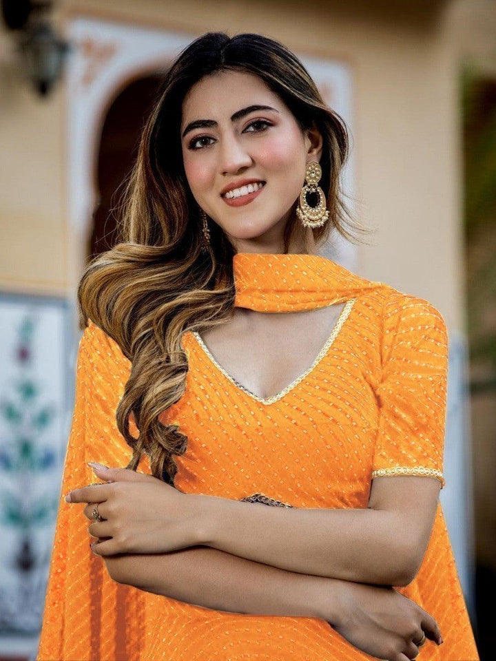 Enchanting Orange Laheriya Print Georgette Designer Lehenga Choli
