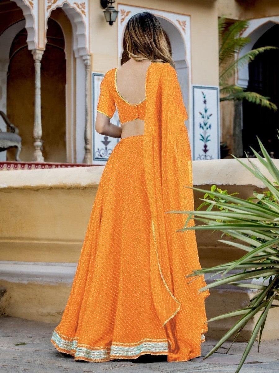 Enchanting Orange Laheriya Print Georgette Designer Lehenga Choli