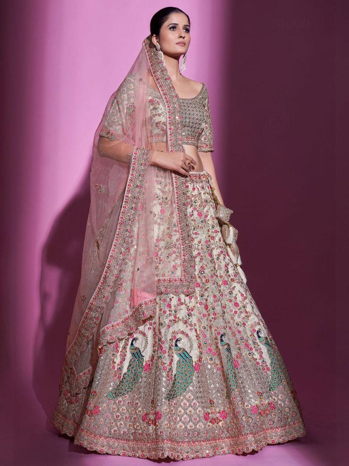 Cream Sequins Soft Net Wedding Wear Lehenga Choli