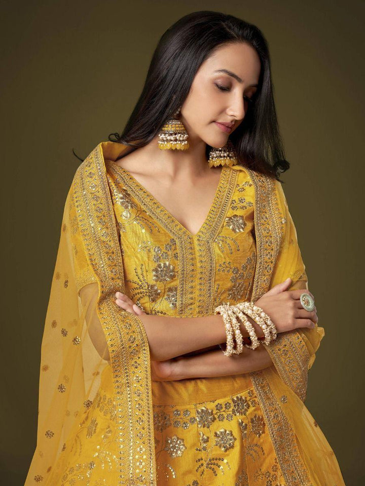 Attractive Yellow Sequins Slub Silk Wedding Wear Lehenga Choli