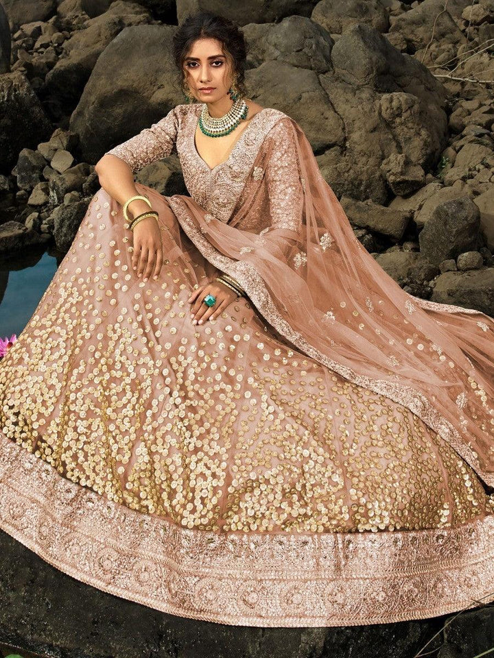 Brown Zari Worked Net Engagement Wear Lehenga Choli