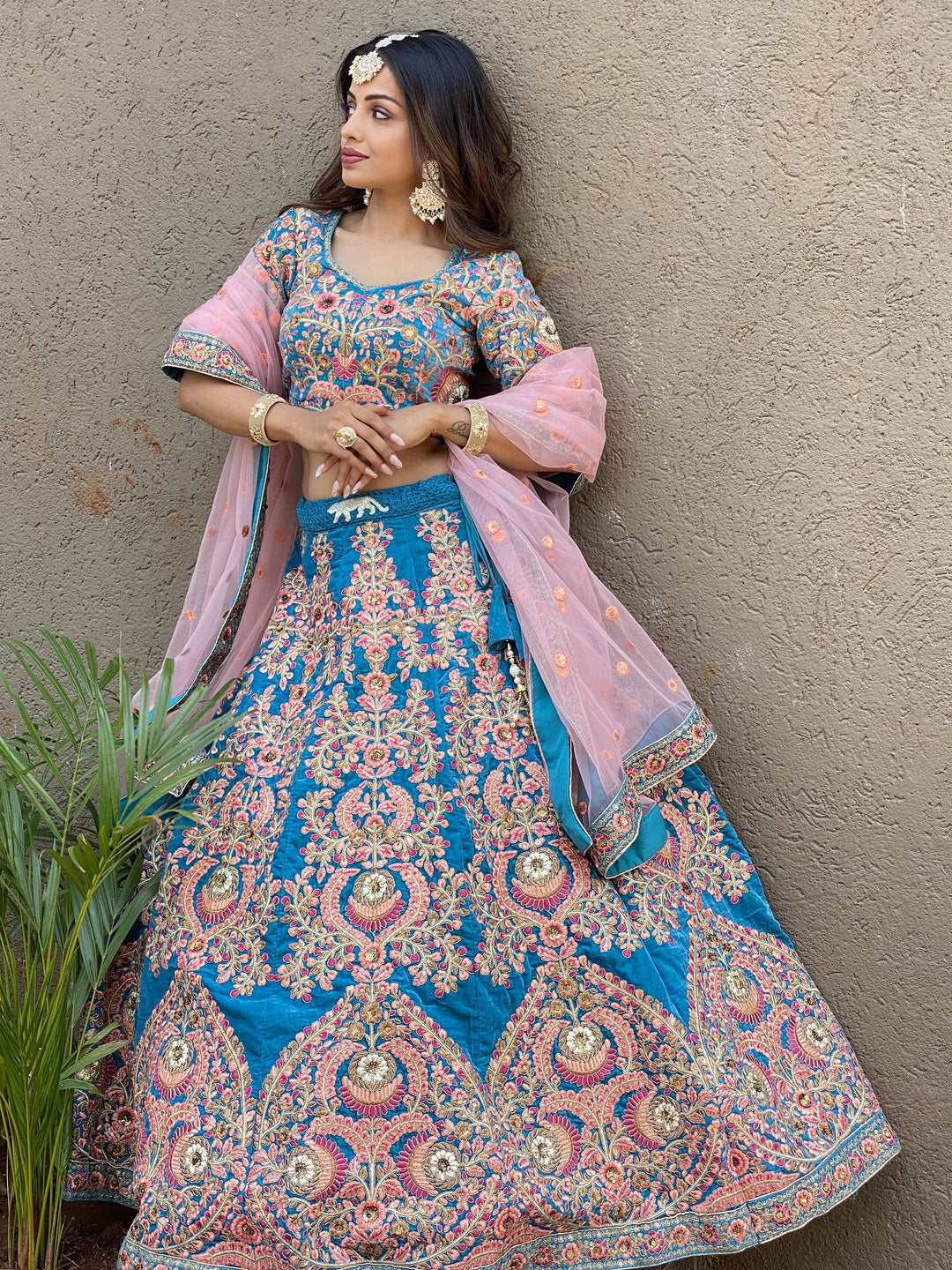 Attractive Blue Embroidered Velvet Wedding Wear Lehenga Choli