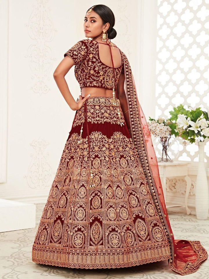 Impressive Red Embroidered Work Velvet Bridal Wear Lehenga Choli