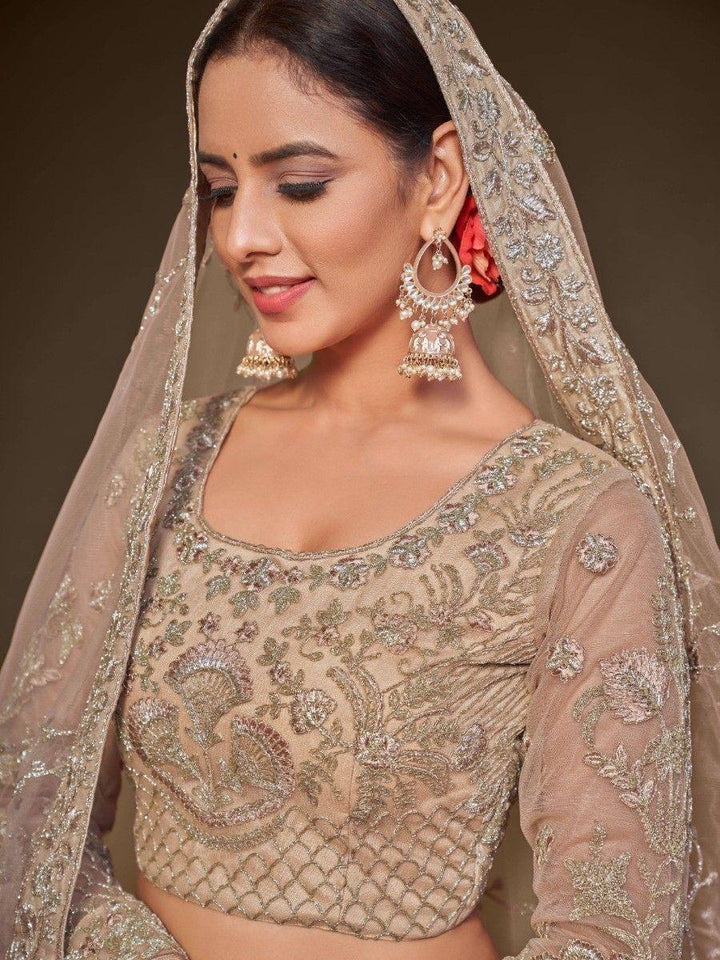 Cute Royal Beige Embroidered Soft Net Engagement Wear Lehenga Choli