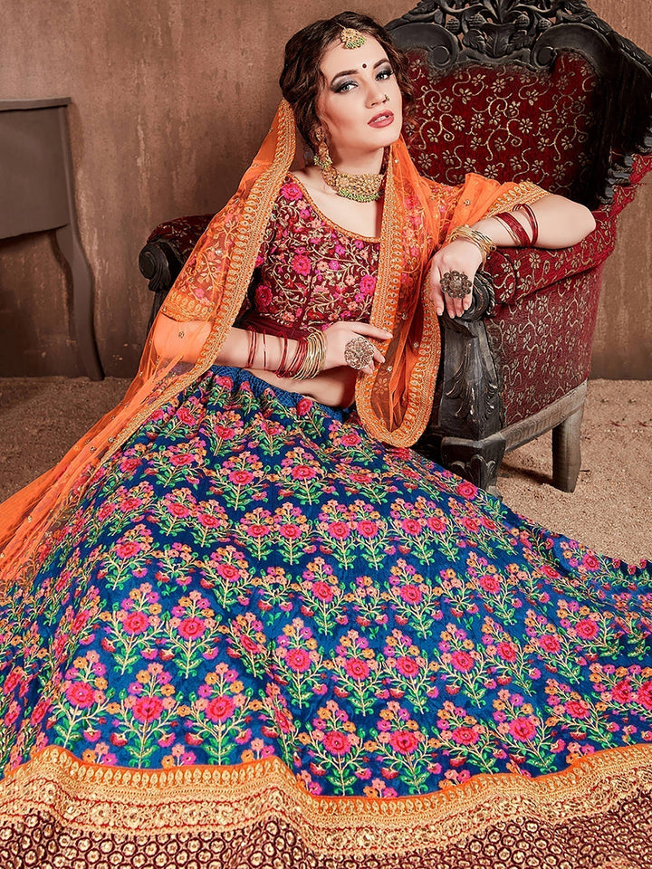 Blue-Red Colored Bridal wear Embroidered Lehenga Choli